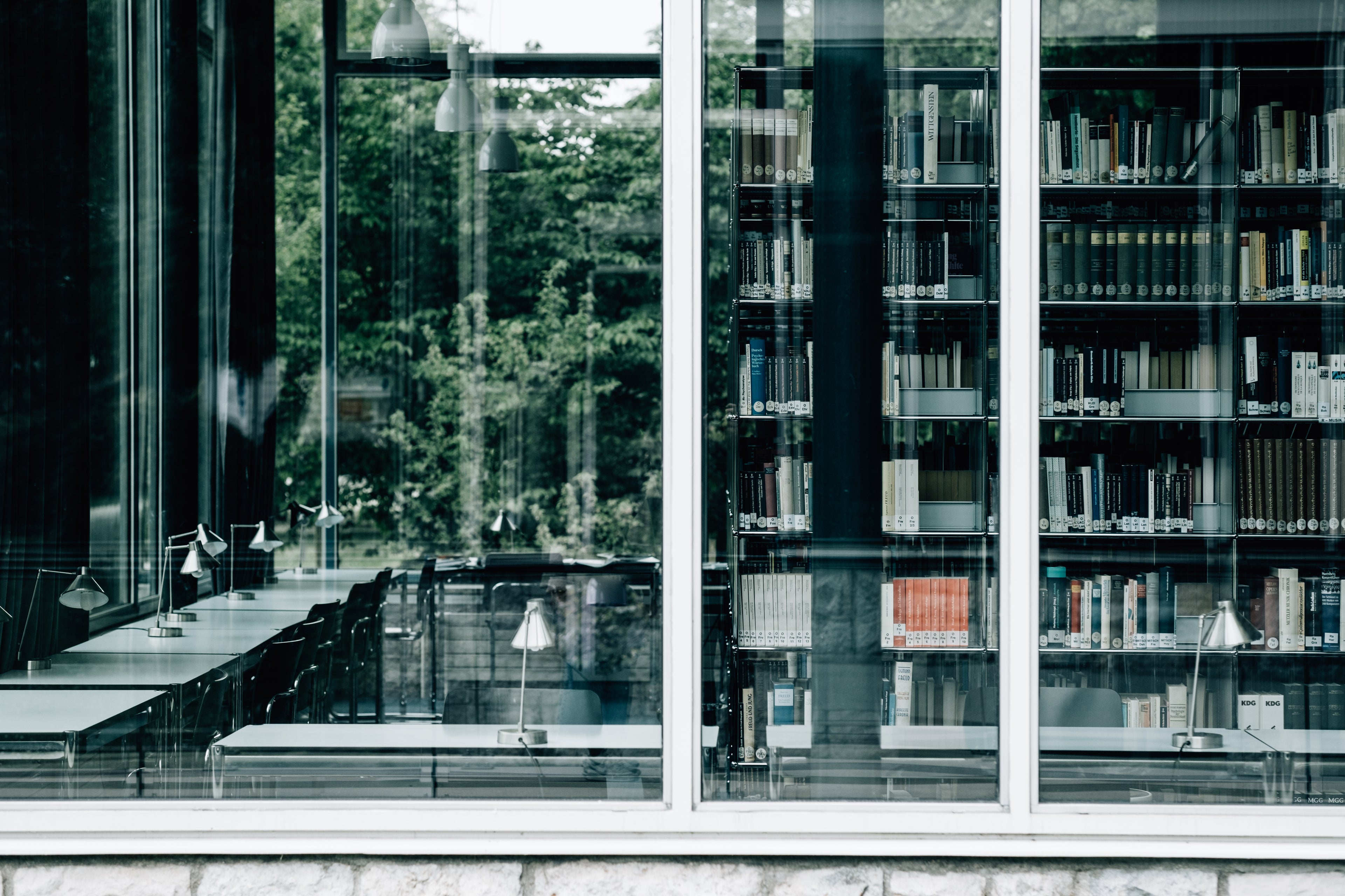 LARGE-WINDOW-WITH-BOOKS-AND-TABLES-INSIDE